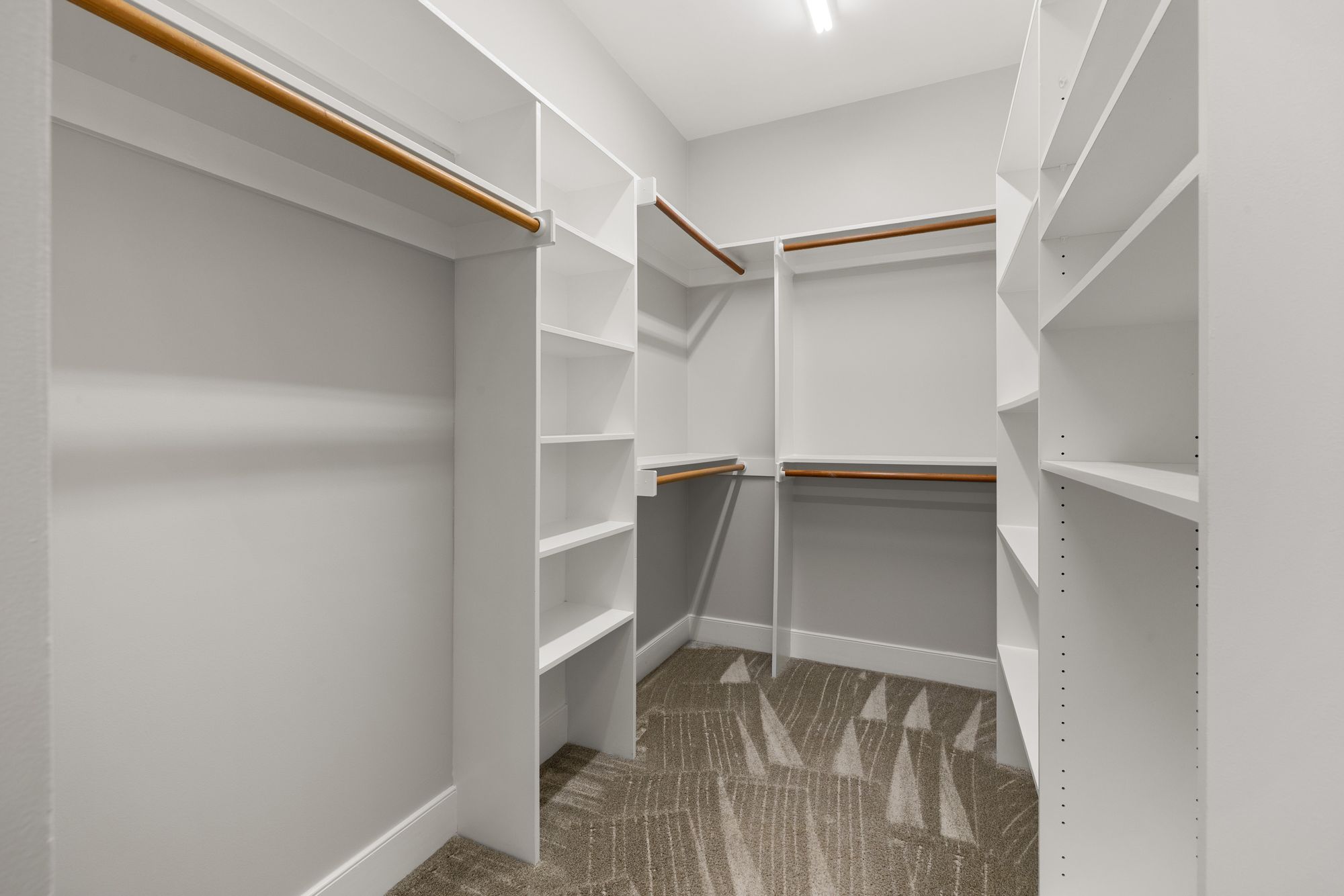 Before: builder-standard white wire closet